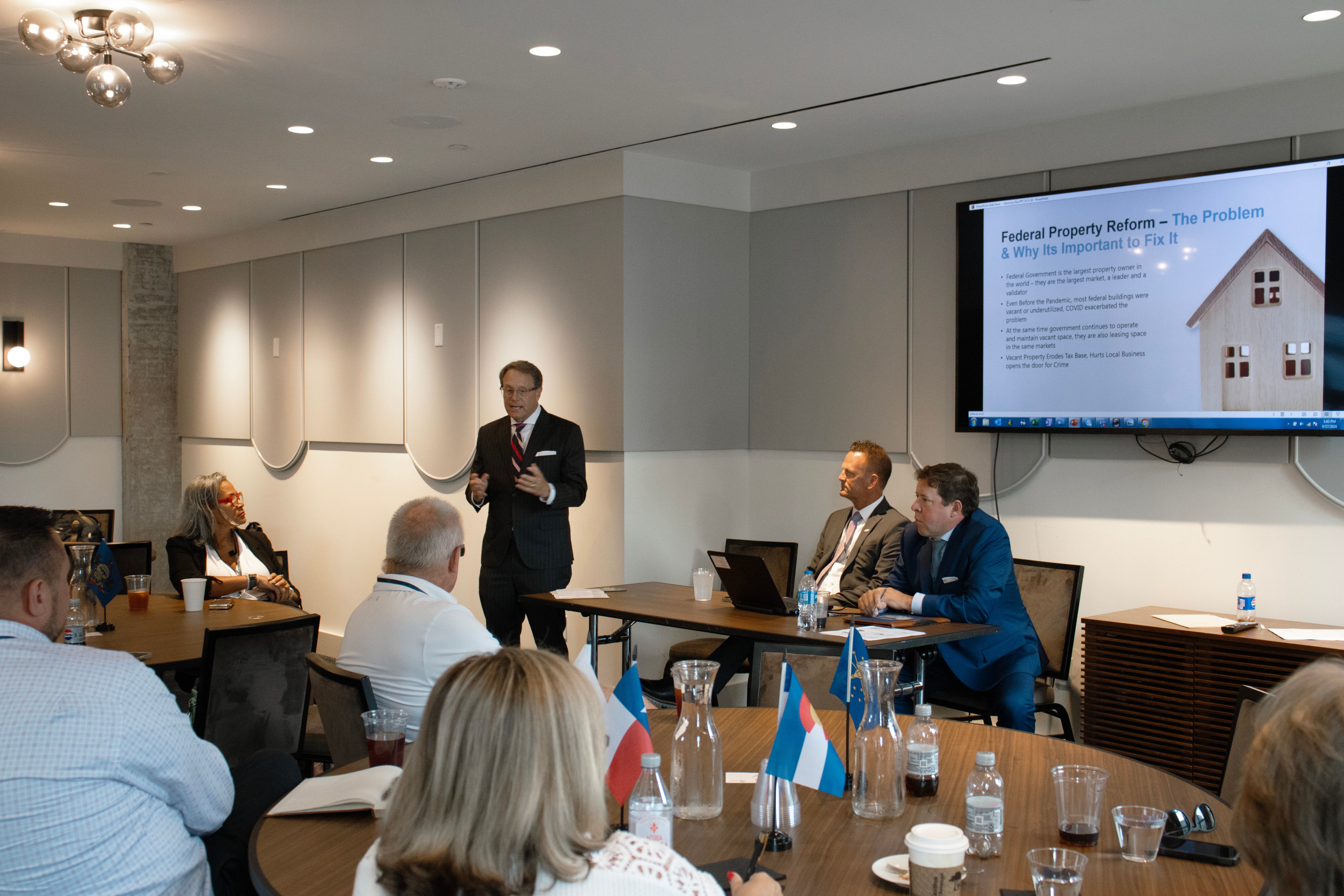 person speaking in front of a group
