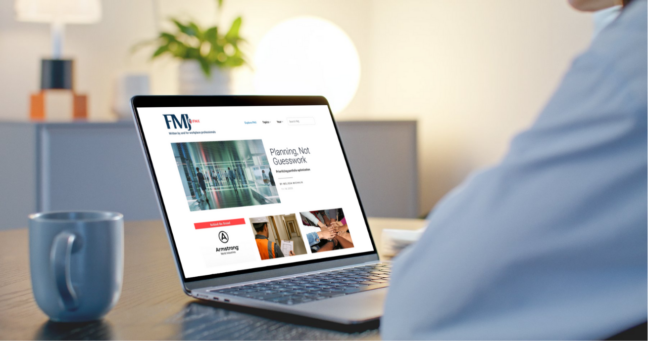 person viewing IFMA's FMJ website on a laptop